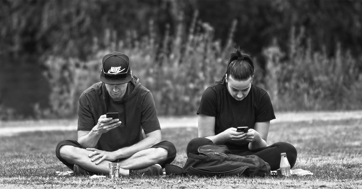 couple looking at their phones