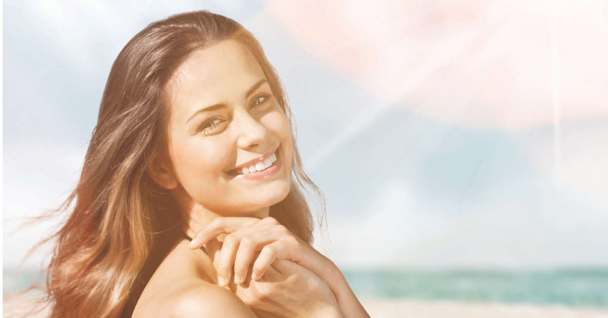 WOMAN SMILING BEACH