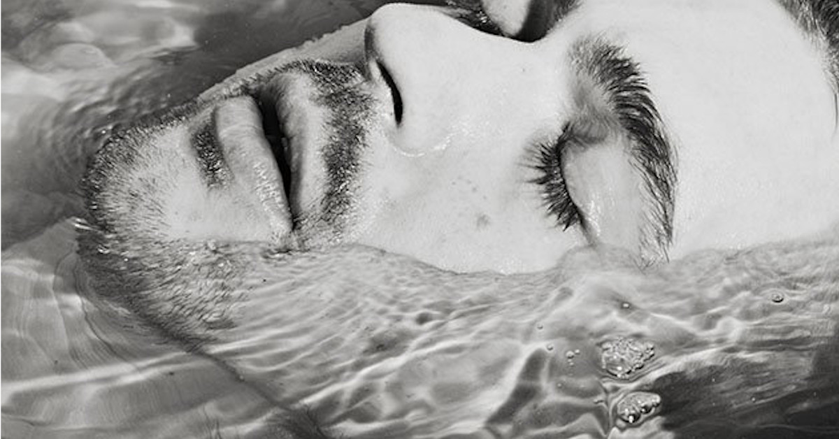 man underwater bw