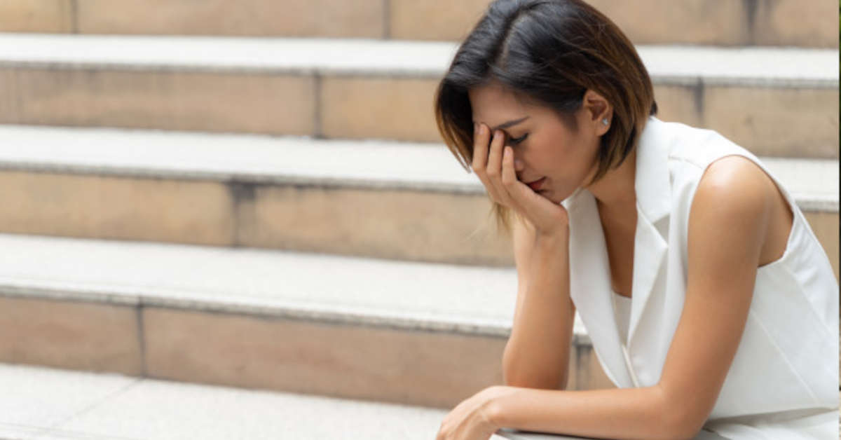 sad woman stairs
