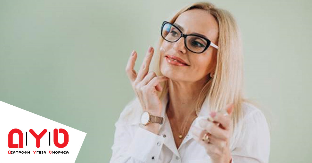 happy woman applying face cream