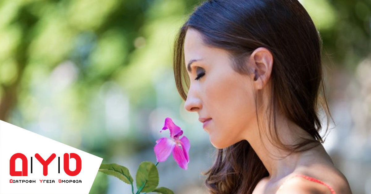 woman smelling flower 1