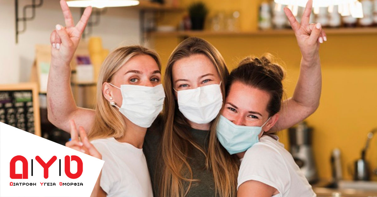 women waering masks selfie