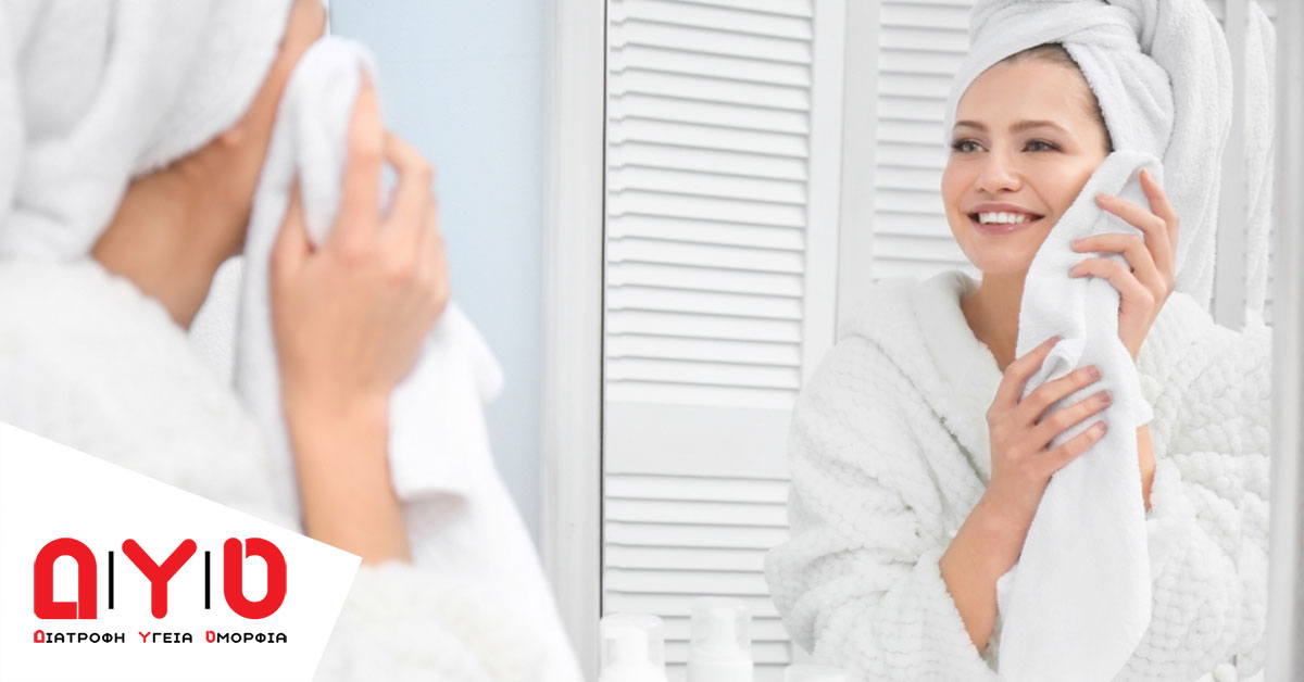 womn in bathroom using towels