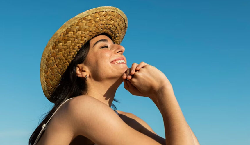 smiley-woman-posing-beach-side-view