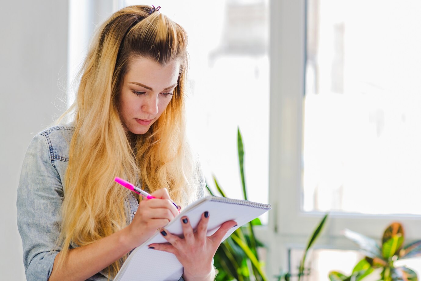 young-girl-writing-notepad_23-2147656256