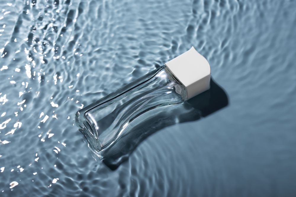 close-up-perfume-floating-water